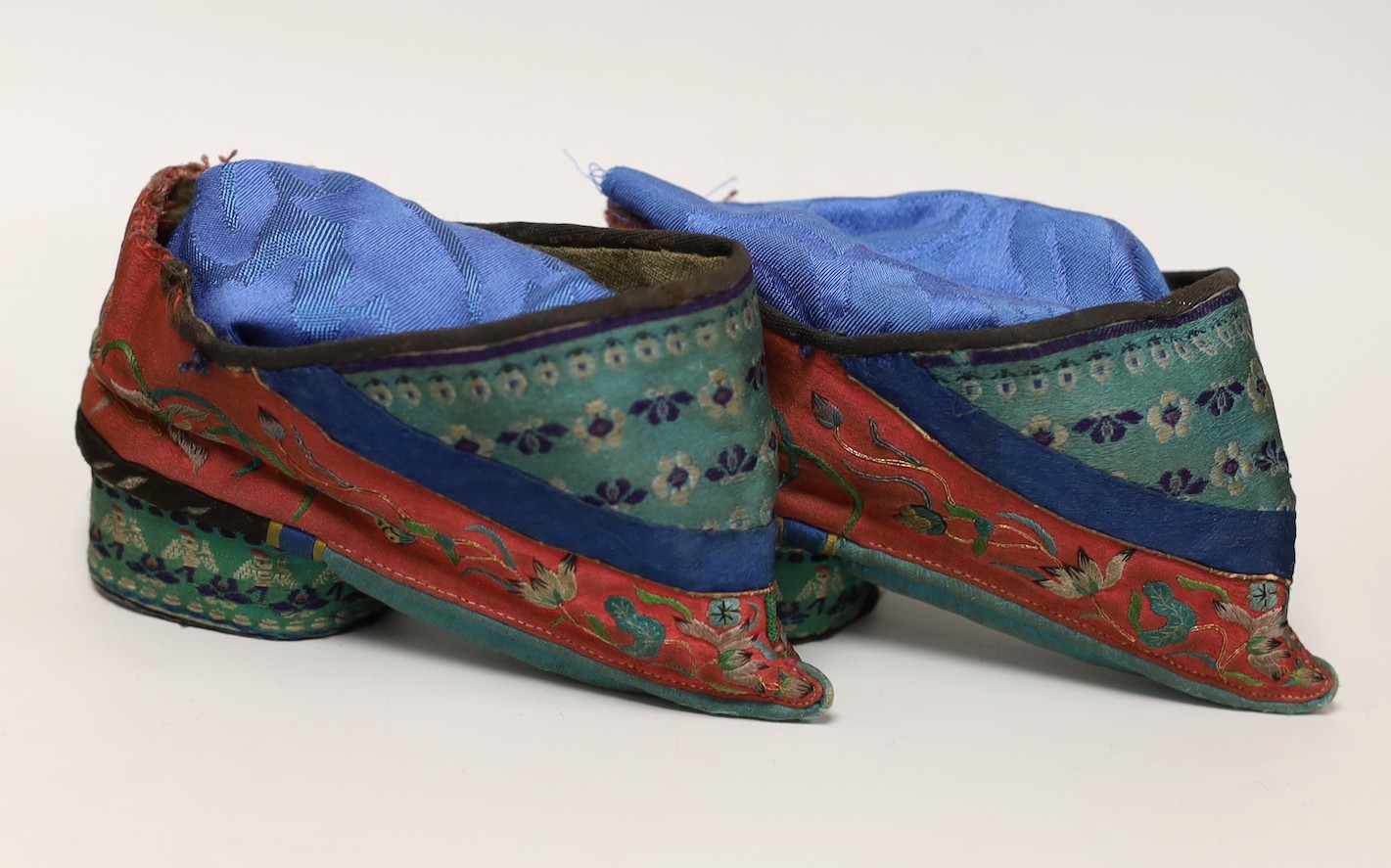 A pair of Chinese silk embroidered ladies shoes, for bound feet, 13cms wide